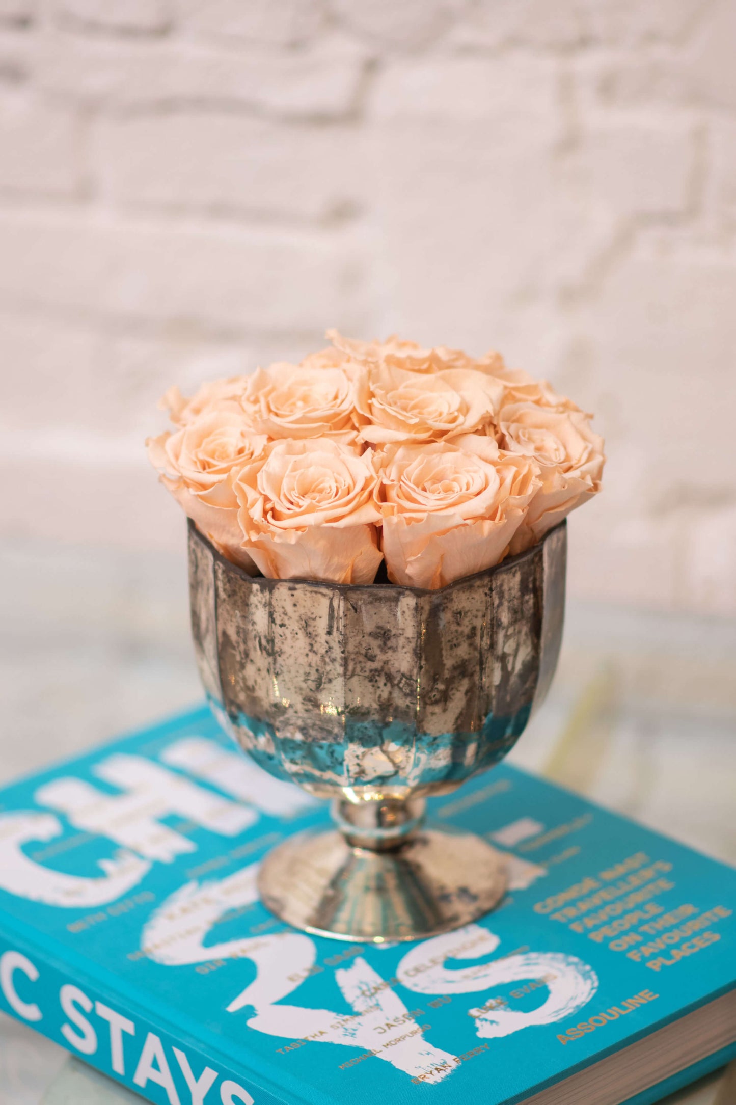 SPLENDOR FOOTED DISTRESSED GOLD VASE WITH PRESERVED ROSES