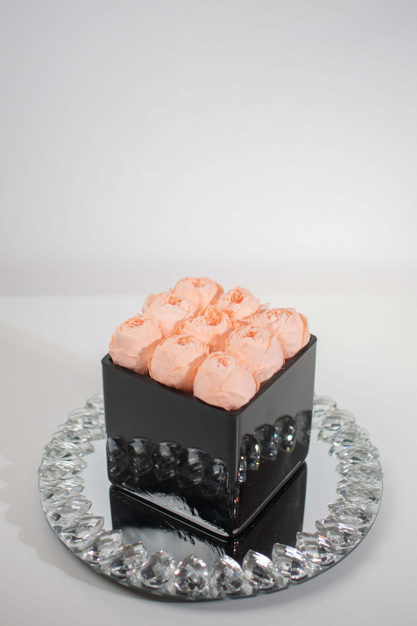 SQUARE BLACK GLASS VASE WITH PRESERVED PEACH PEONIES